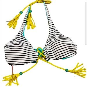 VS strips and turquoise with lime green. It is Reversible Bikini Top size large